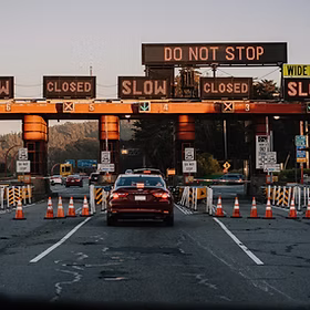 Image by Frames For Your Heart Car on the highway and construction cones and signs